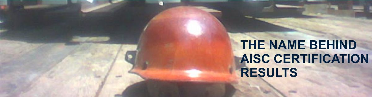 An ironworker's hardhat sitting on the flatbed truck behind a load of steel while he takes a break from the AIC certification audit process.