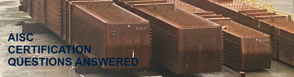 Steel columnswith welded studs are staged for erection. This image shows the true scale of AISC certification work.